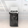 Trail Trash Magnetic Overlanding Trash Holder attached to vehicle, designed for durability and seamless integration in overland setups.