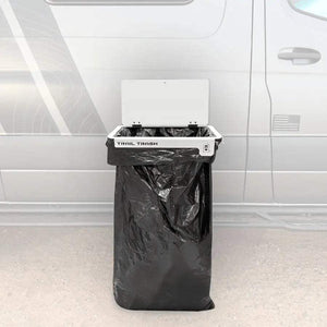 Trail Trash Magnetic Overlanding Trash Holder attached to vehicle, designed for durability and seamless integration in overland setups.