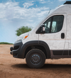 Promaster van equipped with matte black Talon wheels featuring multi-spoke design and rugged tires