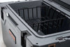 45QT Rugged Cooler with sturdy gray exterior and removable black wire basket for versatile outdoor use