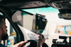 Multi Axis Sun Visor installed in a Sprinter van interior.