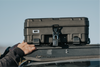 83L Rugged Mount securing a rugged case with a lock on a roof rack