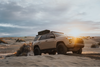95L Rugged Mount on roof rack of SUV in desert at sunset
