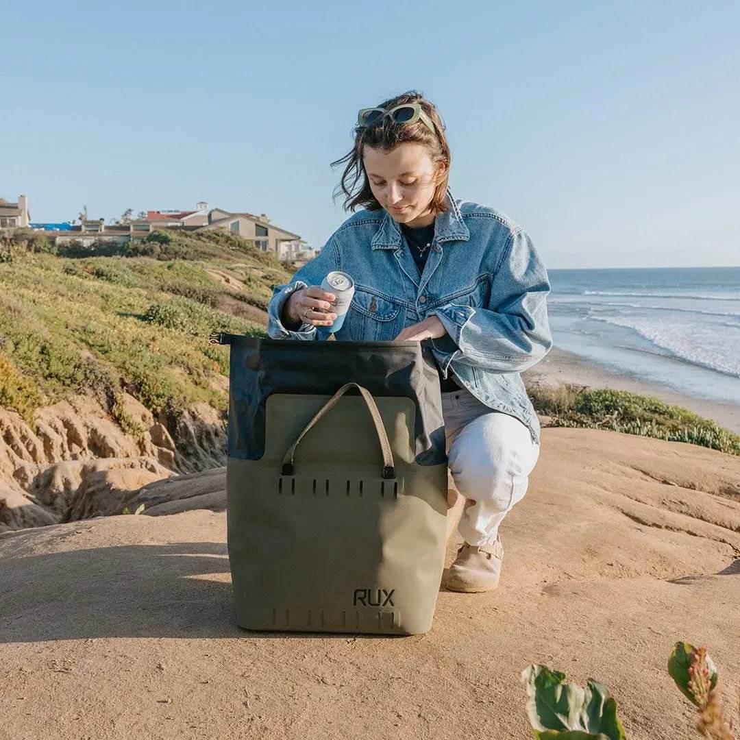 25L Soft Cooler Bag on rocky shoreline, ideal for off-grid adventures and overland setups.