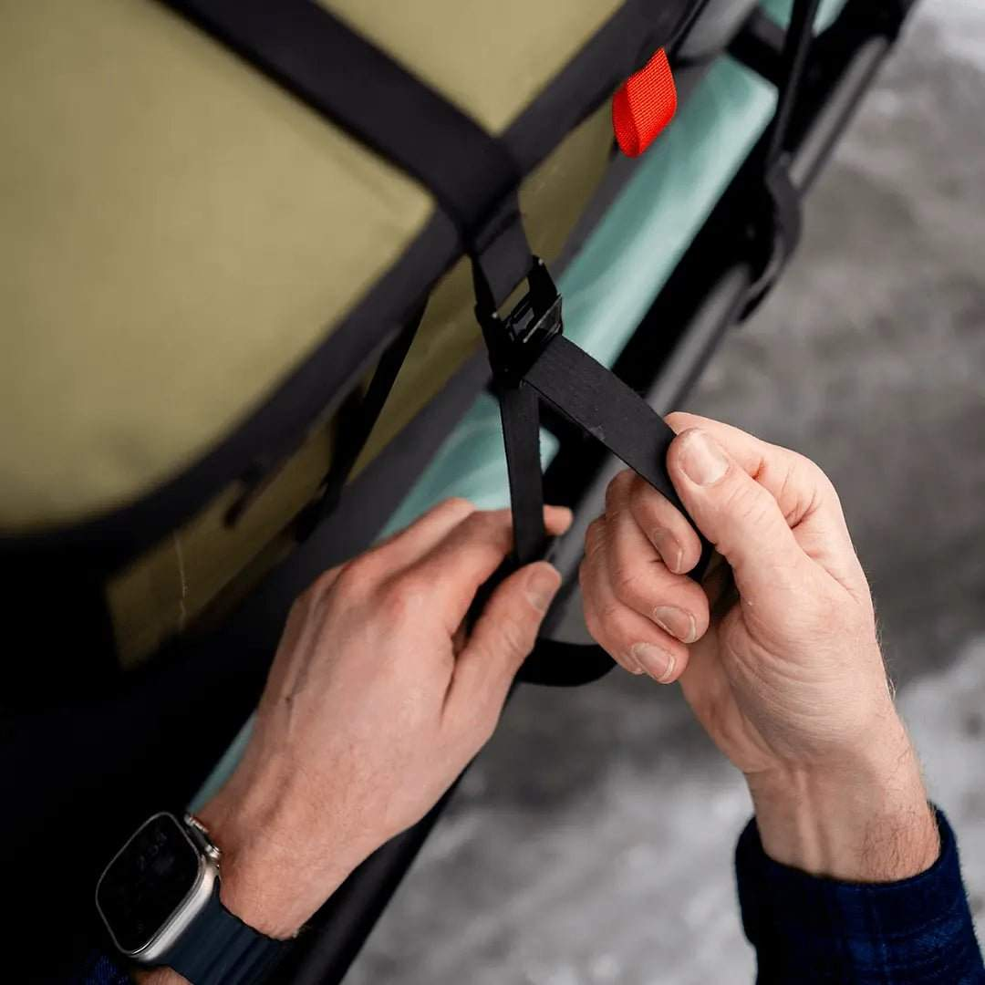 Tie-Down Straps being secured on adventure gear for durability and utility.