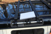 Starlink Mini Roof mount installed on INEOS Grenadier roof rails with adjustable aluminum frame and anti-theft kickstand.