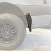 Mondo Mudguard Big Tire Kit for Sprinter and Revel with black mudflap in wheel well.