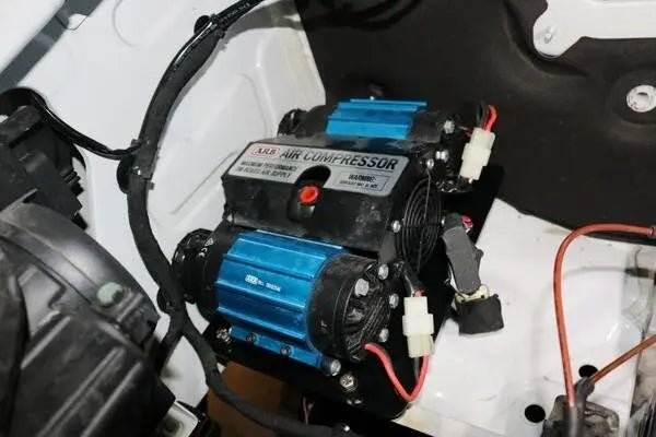 Air Compressor mount for 2019+ Sprinter under hood installation with ARB Twin Compressor, showcasing robust steel construction and powder-coated finish.
