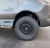Large tire fender relocation kit on 2019+ Sprinter VS30 for oversized tire clearance.