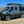 Van in the desert shown with oversized tires